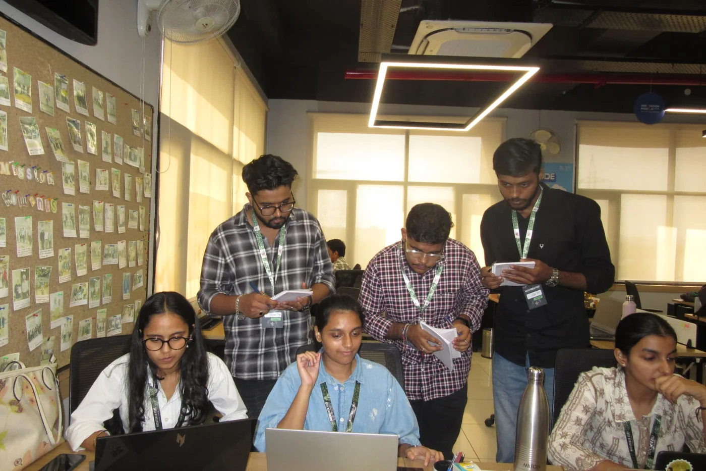 Hackers collaborating around laptops during Hacktoberfest Hack Day Chandigarh
